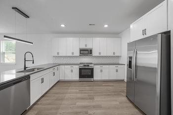 Open concept kitchen with island or bar